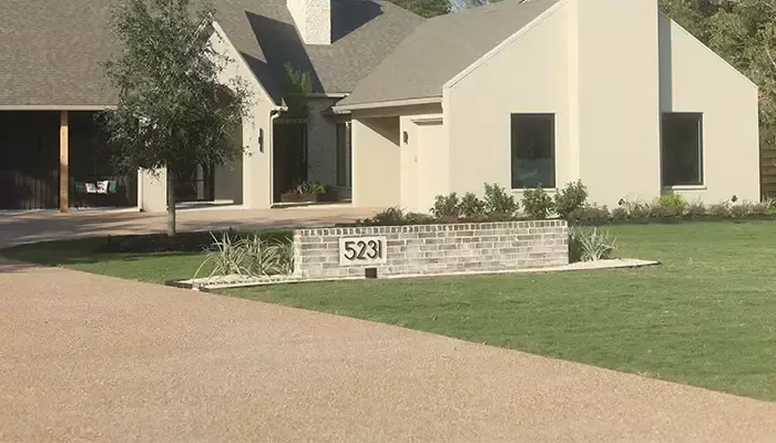 Summer lawn care during the summer with luscious green yard photoed.